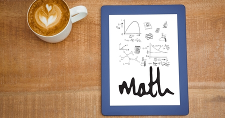 Digital composite of Overhead view of various math equations in digital tablet by coffee cup at...