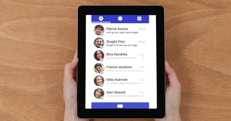 Digital composite of Overhead view of chat list on tablet computer held by person at table
