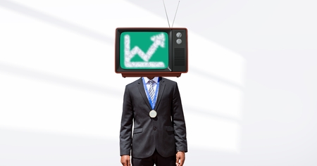 Digital composite of Businessman with TV on headの写真素材