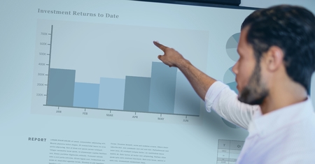 Digital composite of Side view of businessman pointing at graphの写真素材