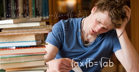 Digital composite of Digital composite image of various math equations by tensed college students studying at table in liの写真素材