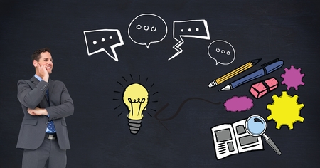 Digital composite of Digital composite image of businessman looking at idea graphicsの写真素材