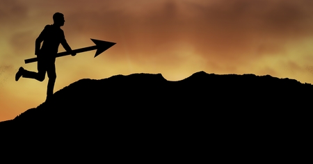 Digital composite of Businessman running with arrow on mountain during sunsetの写真素材