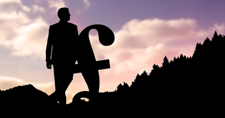 Digital composite of Silhouette businessman with pound sign during sunsetの写真素材