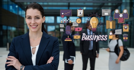 Digital composite of Happy businesswoman with arms crossed standing by business graphicsの写真素材