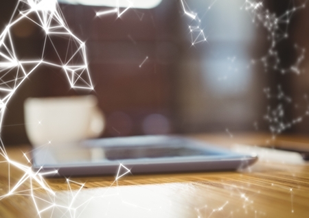 Digital composite of Tablet in cafe and white network overlay