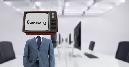 Digital composite of Businessman wearing TV on head with economics text on screenの写真素材
