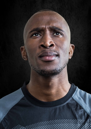 Digital composite of Soccer player against black wallの写真素材