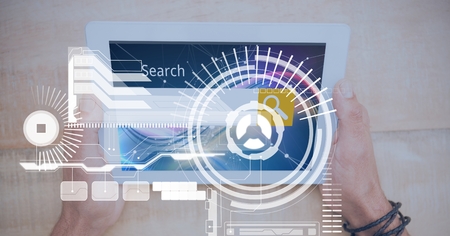 Digital composite of Digital composite image of hand holding tablet PC with graphicsの写真素材