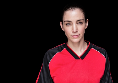 Digital composite of Woman in jersey against black background