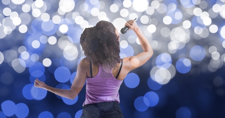 Digital composite of Music artist singing over bokehの写真素材