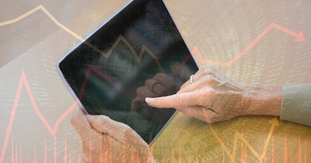 Digital composite of Digital composite image of hands using tablet PC with binary code and graphs