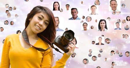 Digital composite of Female photographer with flying portraitsの写真素材