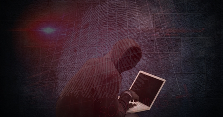 Digital composite of Digital composite image of hacker using laptop with thumb print on screenの写真素材