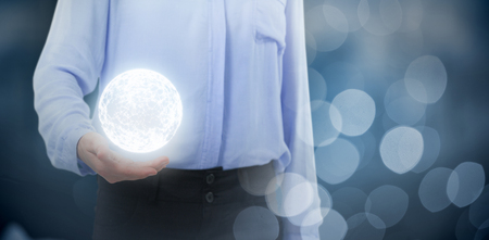 Businesswoman gesturing against white background against glowing backgroundの写真素材