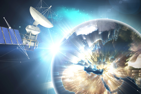 3d solar powered satellite against earth seen from spaceの写真素材