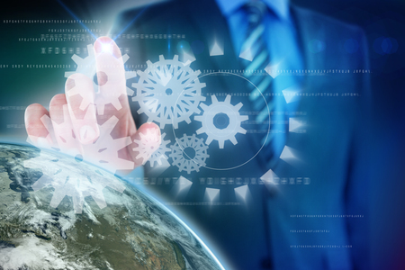 Midsection of businessman using futuristic digital screen against blue background with vignetteの写真素材