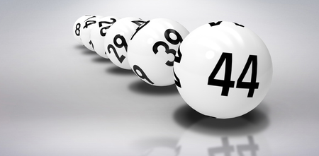 Line of lottery balls against grey background
