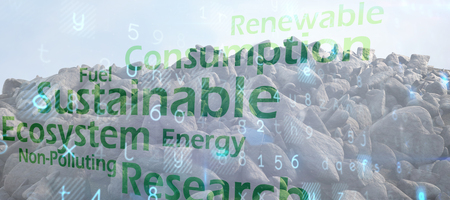 pile of rocks against creative image of green economy conceptの写真素材