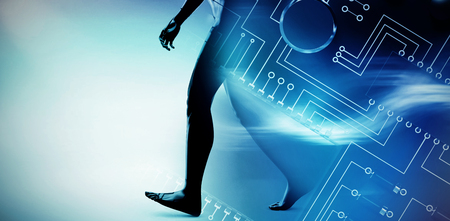 Circuit board against white background against glowing backgroundの写真素材