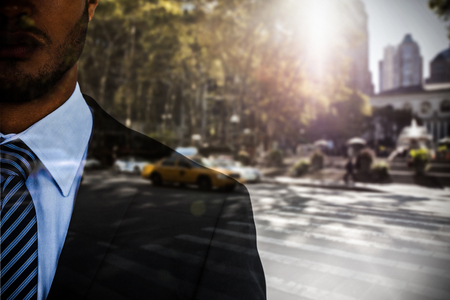 Portrait of serious businessman  against picture of a zebra crossingの写真素材