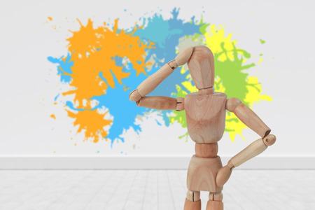 Colourful paint splashes against gray flooring and wallの写真素材