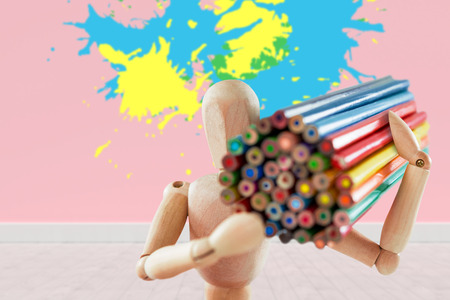 Colourful paint splashes against gray flooring and wallの写真素材