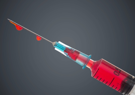 Digital composite of Syringe with red liquid against grey backgroundの写真素材