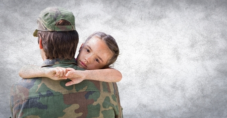 Digital composite of Back of soldier with daughter against white wall with grunge overlayの写真素材