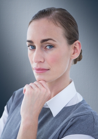 Digital composite of Close up of business woman thinking against navy backgroundの写真素材