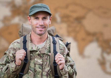Digital composite of Soldier with backpack against blurry brown map