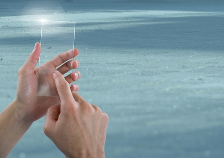 Digital composite of Hand Touching Glass Screen with cool backgroundの写真素材