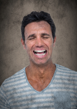 Digital composite of Man crying against brown background with grunge overlayの写真素材