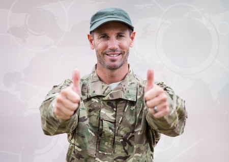 Digital composite of Soldier thumbs up against white map with interfaceの写真素材