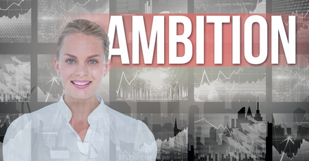 Digital composite of Smiling businesswoman with ambition text in backgroundの写真素材