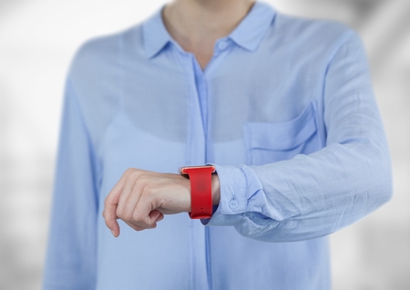 Digital composite of Midsection of businesswoman wearing smartwatch