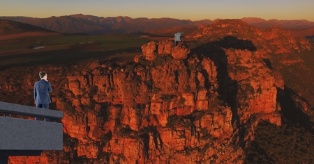 Digital composite of businessman in the corner of bridge looking the checker flag in the mountain...