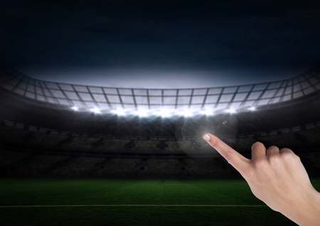 Digital composite of Hand touching sports stadiumの写真素材
