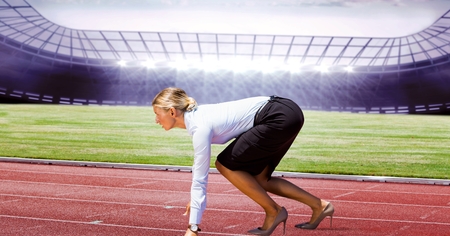 Digital composite of Side view of businesswoman on running tracksの写真素材