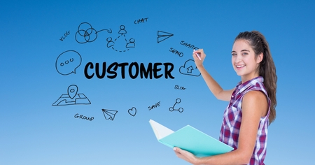 Digital composite of Businesswoman drawing icons by customer text on screenの写真素材