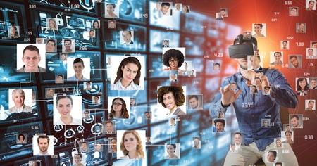 Digital composite of Man looking at flying portraits on VR glassesの写真素材