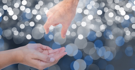 Digital composite of Hands gesturing over blur background
