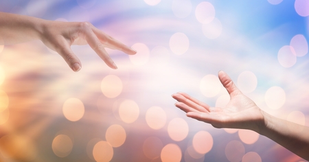 Digital composite of Cropped image of woman reaching man against bokehの写真素材