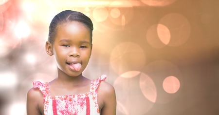 Digital composite of Little girl teasing over bokehの写真素材