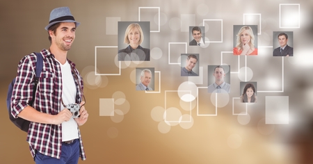 Digital composite of Happy male photographer looking at flying business photographsの写真素材