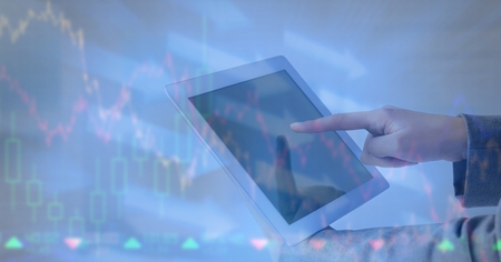 Digital composite of Hands using digital tablet with overlayの写真素材