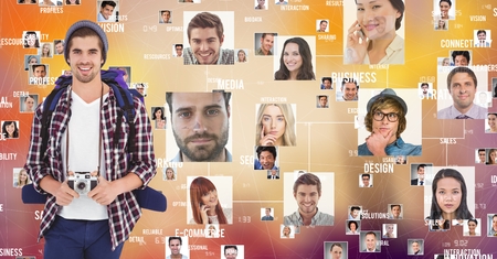 Digital composite of Smiling hiker with flying portraitsの写真素材