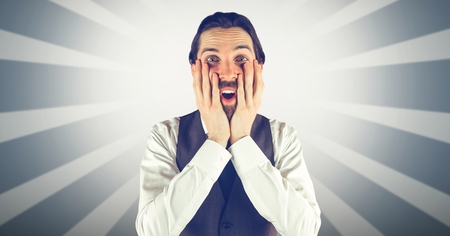 Digital composite of Surprised man with hands on cheeks against bright backgroundの写真素材