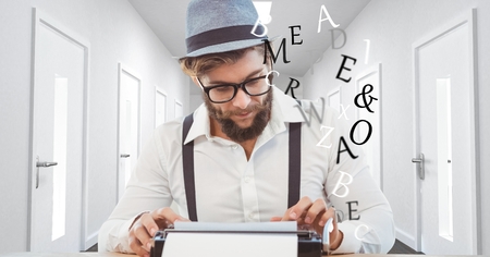 Digital composite of Hipster using typewriter in office