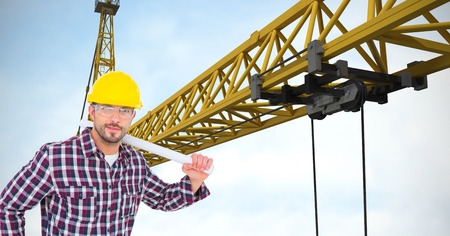 Digital composite of Confident architect holding blueprints by crane